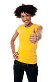 Happy smiling lady showing thumbs up gesture