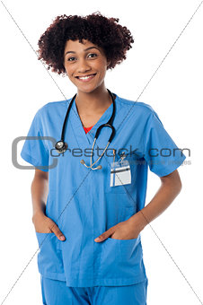 Friendly female doctor smiling isolated over white
