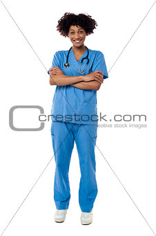 Cheerful nurse posing with arms crossed