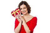 Woman closely holding gift from her boyfriend