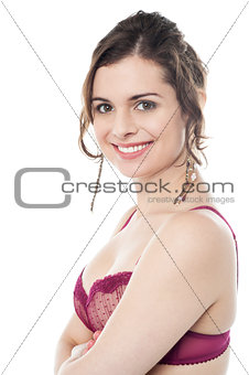 Alluring female model in pink brassiere
