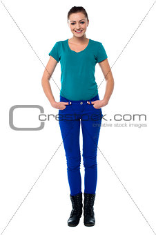 Pretty woman with hands in jeans pocket