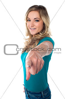 Cute young girl pointing you out