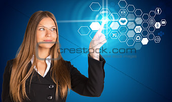 Young woman pressing button within pointer finger of left hand
