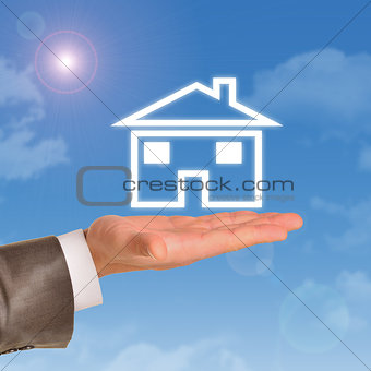 House model in right hand of real estate agent