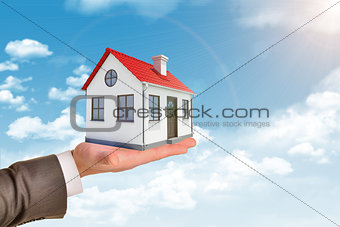  Shot of man holding house model