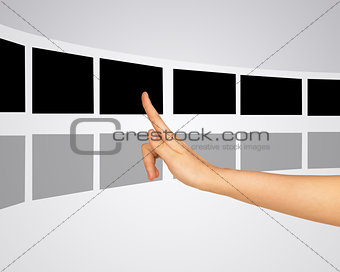 Woman pressing virtual photo within right pointer finger
