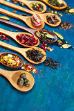Dry tea with in wooden spoons