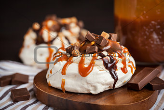 Caramel and chocolate Pavlova meringue cake