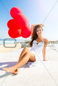 Girl with red ballons