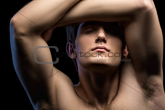 Close-up portrait of an attractive man with naked torso