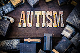 Autism Concept Wood and Rusted Metal Letters
