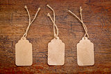 blank paper price tags on rustic wood