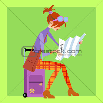Tourist sitting on the suitcase and looks map