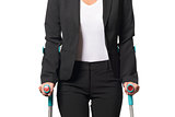 Disabled Businesswoman Walking with Two Crutches