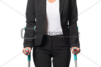 Disabled Businesswoman Walking with Two Crutches