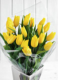 beautiful bouquet of yellow tulips on a white background