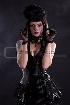 Sensual gothic girl in hat with veil 