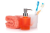 Toothbrushes, liquid soap and towel
