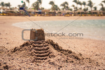 Castle on the sand on a beach.