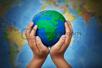 Ecology concept with earth in child hands