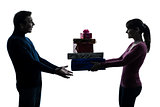 couple woman man offering christmas gifts  silhouette
