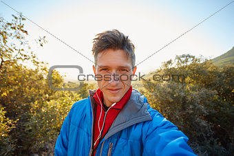 young man on the morning mountains background