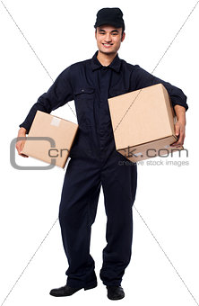 Young courier boy holding parcels