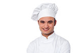 Young smiling confident male chef