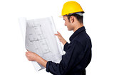 Construction worker reviewing plan