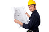 Construction worker reviewing blueprint