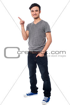 Young man pointing at something interesting