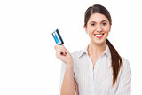 Smiling elegant woman holding credit card