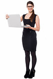 Smart corporate lady holding a laptop