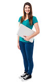 Casual attractive girl holding laptop