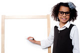 Young kid about to write on whiteboard