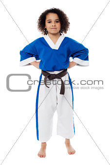 Young confident karate kid posing
