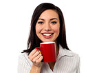 Woman enjoying coffee during work break