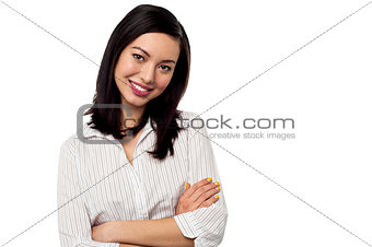 Female secretary posing with arms crossed