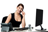 Female executive assisting client over a call