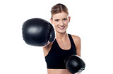 Fitness woman wearing boxing gloves
