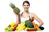 Beautiful young woman with fruits and vegetables