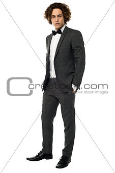 Handsome young groom, full length portrait