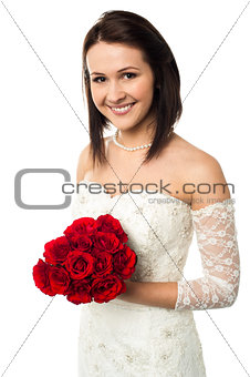 Smiling bride with a rose bouquet
