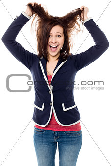 Young girl pulling her hair in excitement