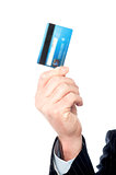 Image of man's hand holding cash card