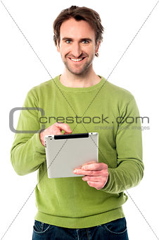 Young guy operating tablet device