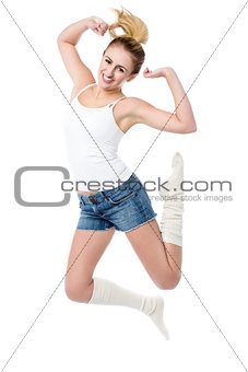 Attractive girl jumping with joy