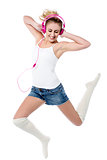 Music lover jumping high in the air