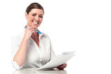 Female executive analyzing business reports